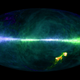 The HI4PI map. The colors reflect the approaching (purple/blue) and receding (orange/green) hydrogen gas velocities relative to Earth, while the brightness corresponds to the amount. The plane of the Milky Way runs horizontally across the middle, and the splotches at the lower right are the Magellanic Clouds. (Image credit: Benjamin Winkel and the HI4PI collaboration)